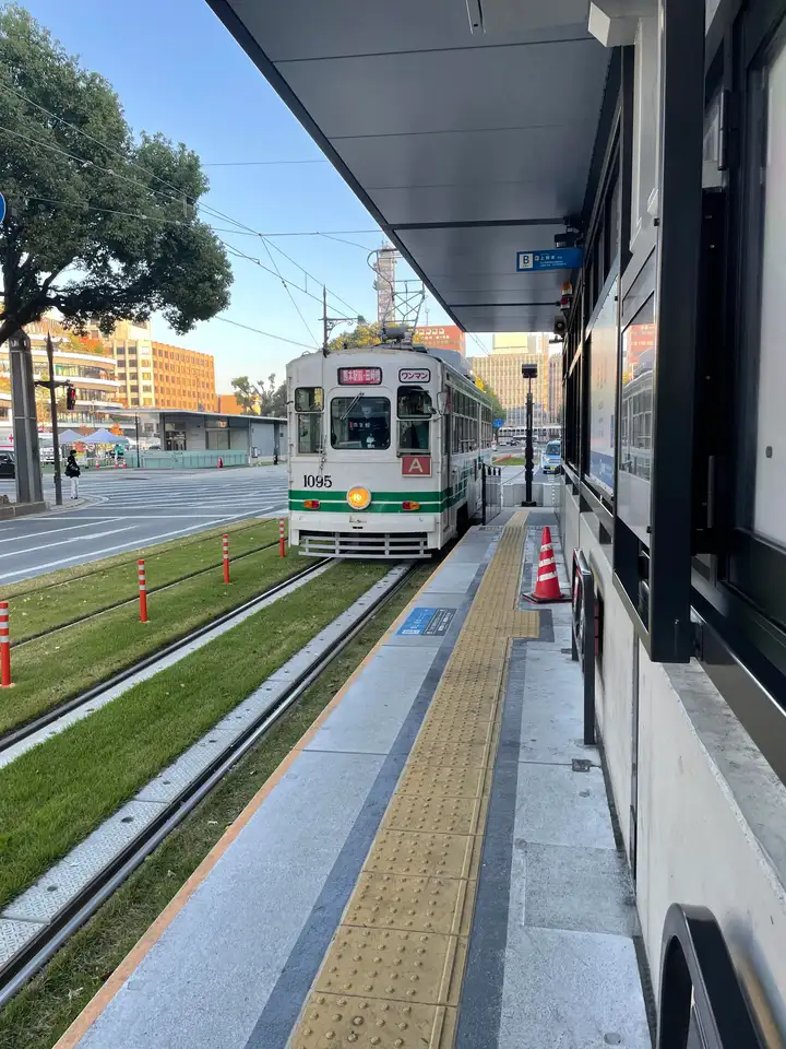 Kumamoto streetcar exterior, approaching a station