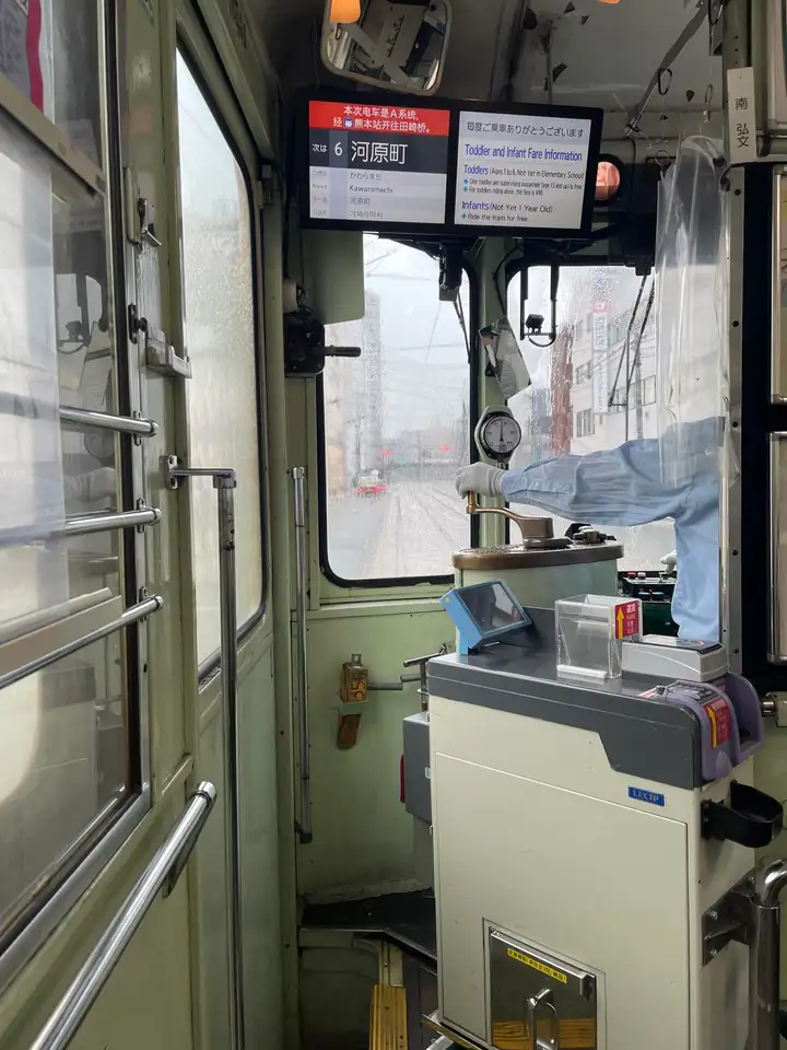Kumamoto streetcar interior and operator control