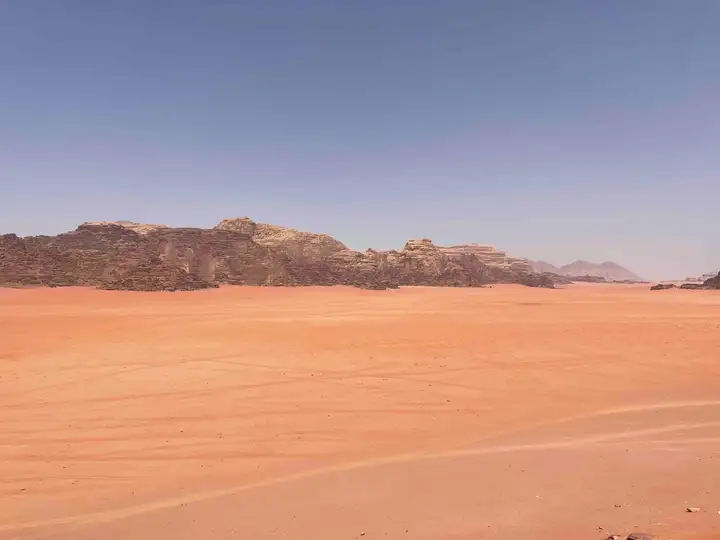 Red sand and rock formations in northern Wadi Rum